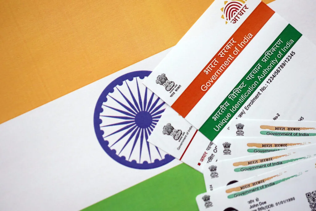 indian aadhaar card from unique identification authority of india on indian flag